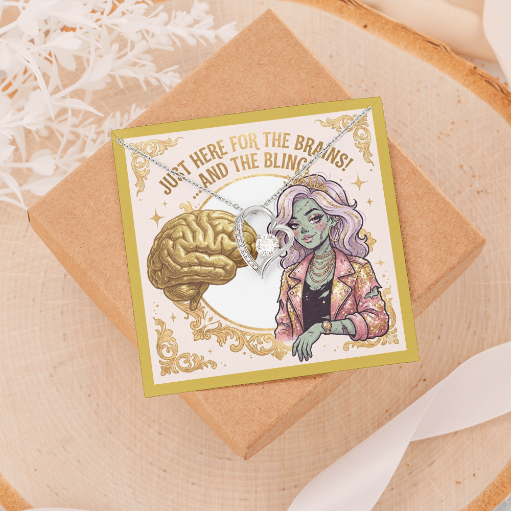 14k white gold over stainless steel heart necklace with cubic zirconia gems on a gold zombie girl jewelry card, placed on top of a light beige jewelry box against a light background with delicate white feathers laying beside it.