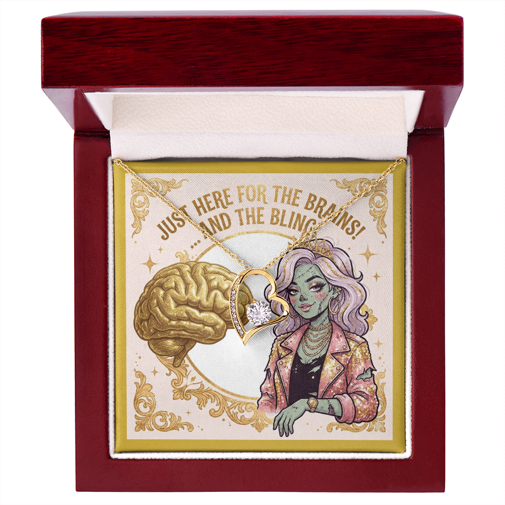 18k gold over stainless steel heart necklace with cubic zirconia gems, displayed on a gold zombie girl fashionista jewelry card inside a luxury gift box with a built-in LED spotlight illuminating the pendant.