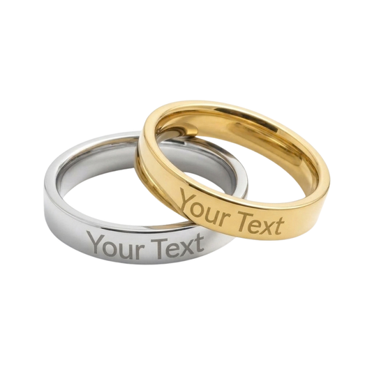 Two polished metal bands, one silver and one gold, overlapping on a white background. Both rings have the placeholder text 'Your Text' engraved on the inside.
