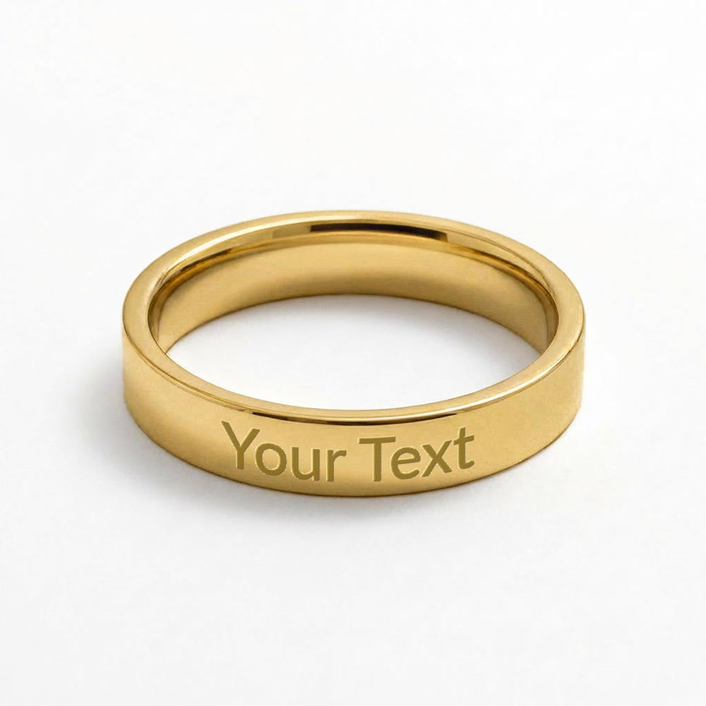 Polished silver stainless steel flat-gold toned profile band ring with sample engraving “Your Text” on a white background.