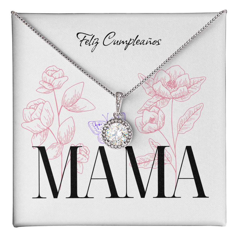 Un collar de plata con un dije redondo de piedra brillante descansa sobre una tarjeta de regalo blanca. En la parte superior, la tarjeta lleva el texto "Feliz Cumpleaños" en letra cursiva, y abajo resalta la palabra "MAMA" en letras grandes y negras. El fondo está decorado con dibujos lineales de flores rosadas y una pequeña mariposa morada.