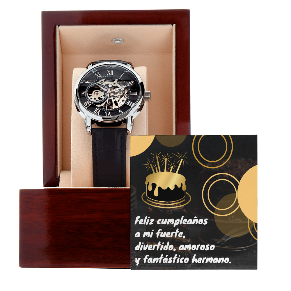 Reloj de pulsera mecánico esqueleto con correa de cuero negro dentro de un estuche de madera abierto, acompañado de una tarjeta negra y dorada que dice "Feliz cumpleaños a mi fuerte, divertido, amoroso y fantástico hermano".