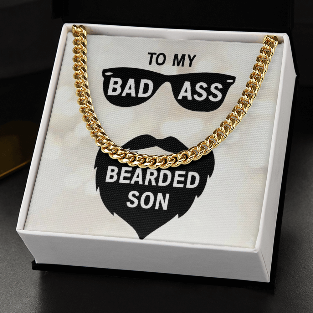18k gold men's Cuban link chain necklace resting on a white gift box insert that reads "To My Bad Ass Bearded Cousin" with a sunglasses and beard graphic.