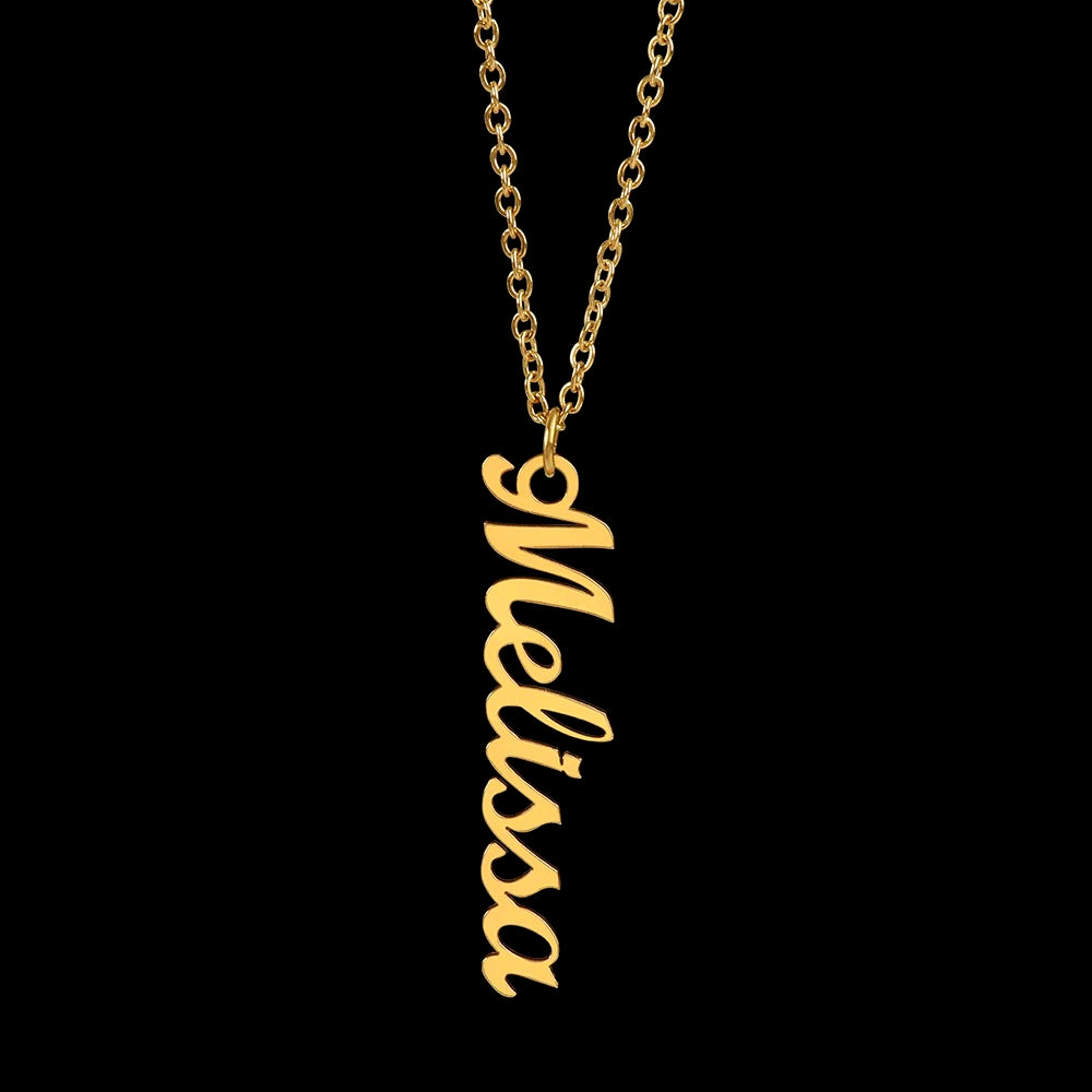 a gold personalized vertical name necklace with a black background.