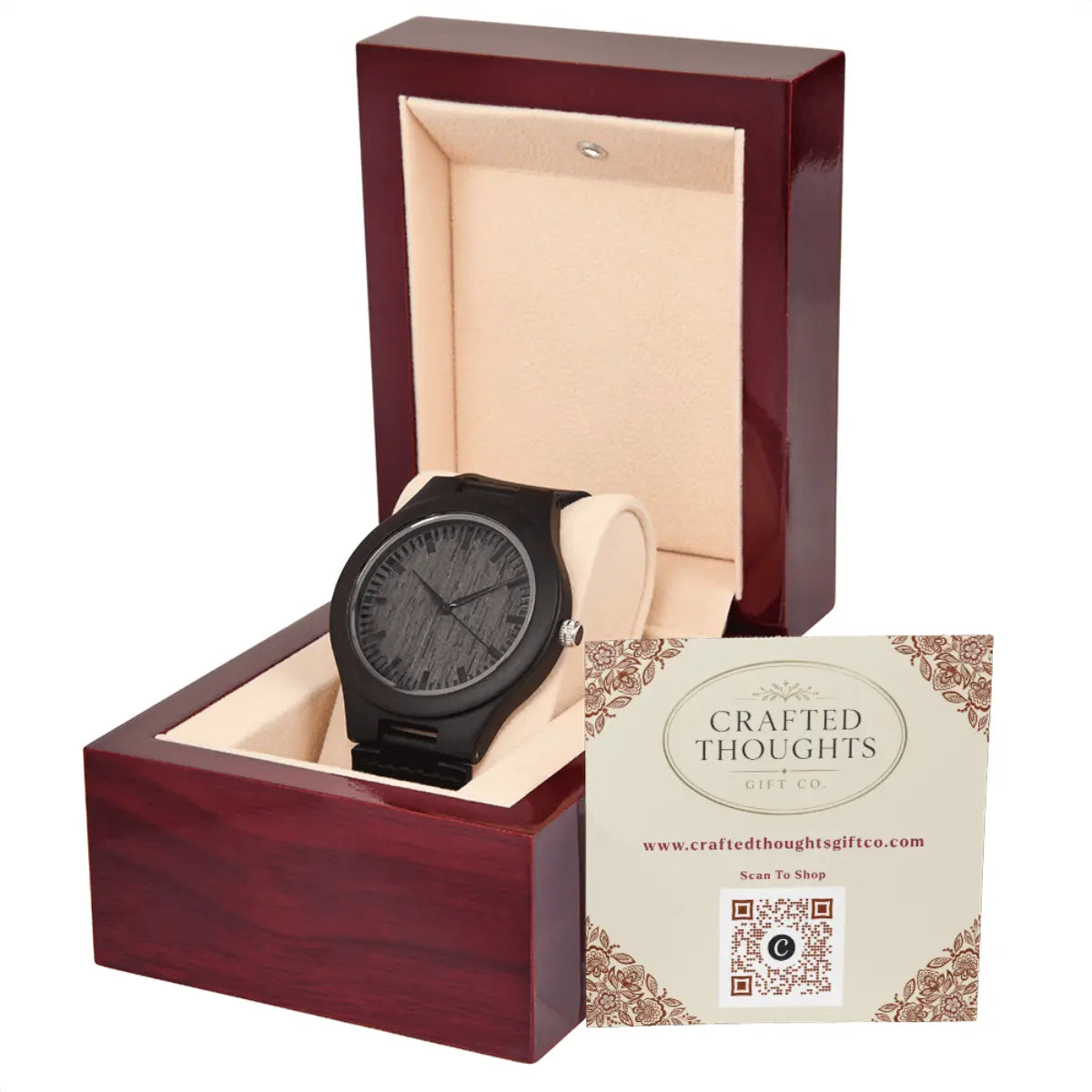 A brown wooden watch with a textured dial and black strap, displayed inside an open dark reddish-brown wooden gift box with a beige interior. A branded card for Crafted Thoughts Gift Co.