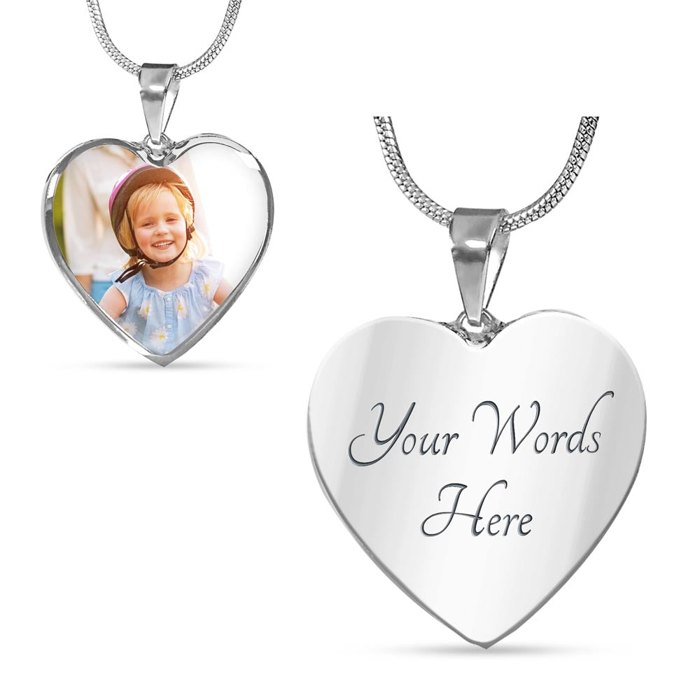Custom engraved heart photo necklace in silver showing the front side with a custom picture print and the reverse side engraved with personalized text.