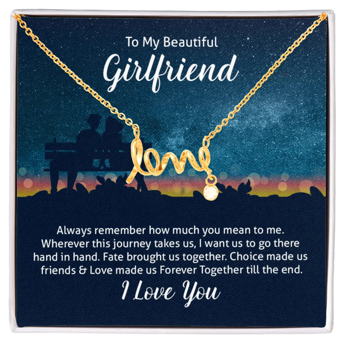 A gold necklace with a cursive 'love' pendant and a small heart charm, displayed on a dark blue gift card with sentimental text addressed to a girlfriend.