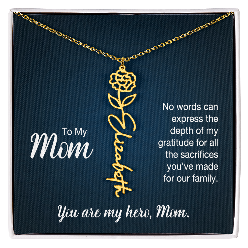 A gold floral filigree necklace with the name 'Elizabeth' engraved, presented on a dark blue gift card with sentimental text for 'Mom'.