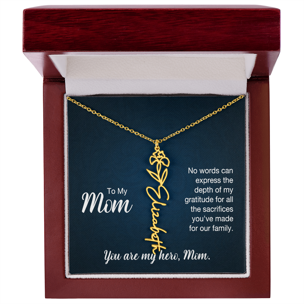 A gold floral filigree necklace with the name 'Elizabeth' engraved, presented on a dark blue gift card with sentimental text for 'Mom', in a luxury mahogany LED spotlight gift box.