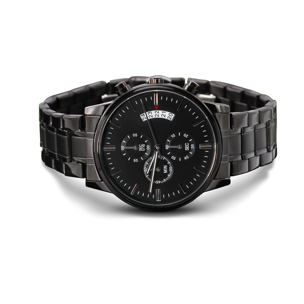 A men's military-style black chronograph watch featuring a matte black dial face and a matching black stainless steel link bracelet. The watch includes three functional sub-dials, white tick indices, a multi-date calendar display window on the top right, and side push buttons.