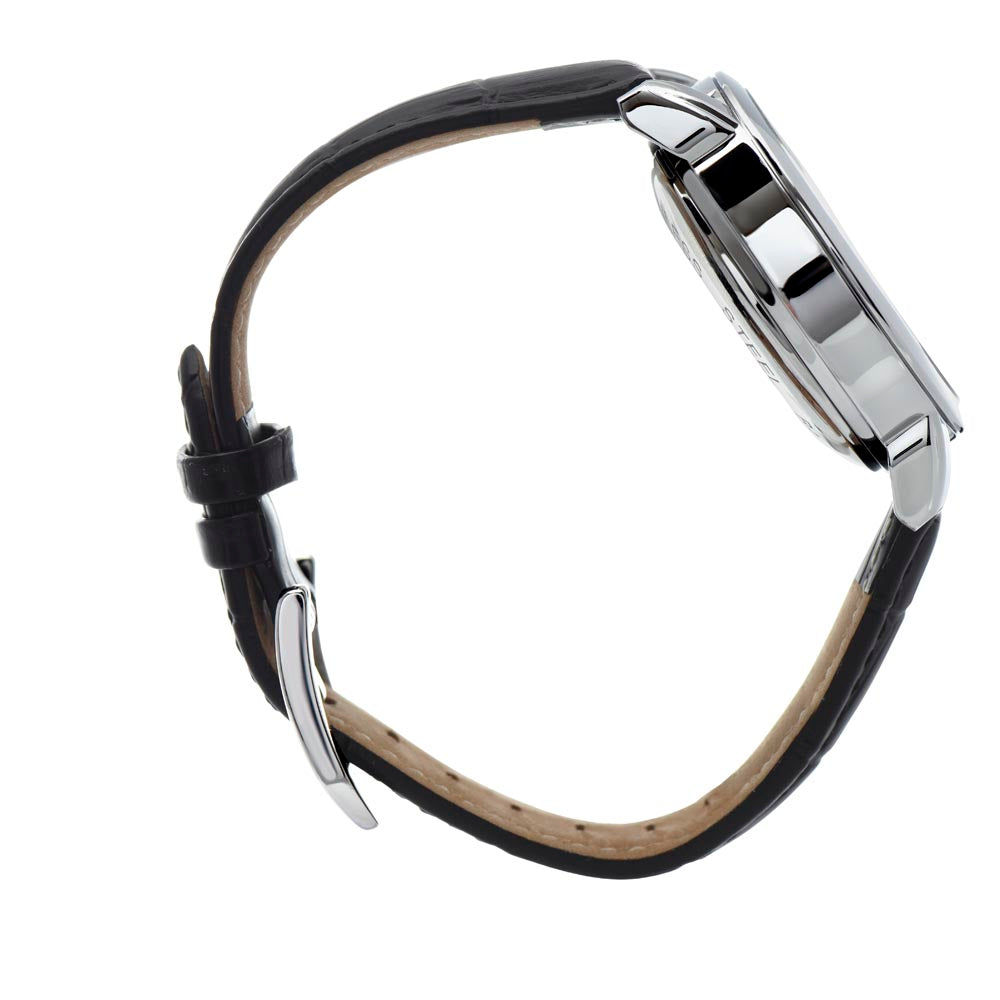 Side view profile photograph of a men's  skeleton watch, showcasing the thickness of the polished stainless steel case, the detail of the textured winding crown, and the secure attachment of the  leather strap.