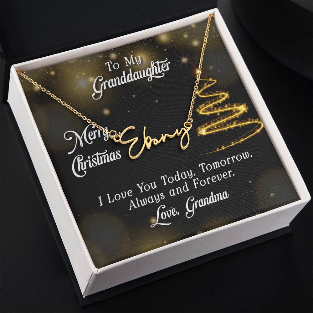 Personalized gold script name necklace on a black Christmas card with gold glitter graphics, inside a white gift box.