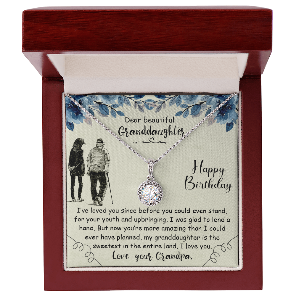 Personalized granddaughter birthday necklace and floral card inside a luxury mahogany wooden LED spotlight gift box.