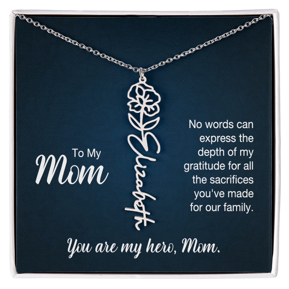 A silver floral filigree necklace with the name 'Elizabeth' engraved, presented on a dark blue gift card with sentimental text for 'Mom'.