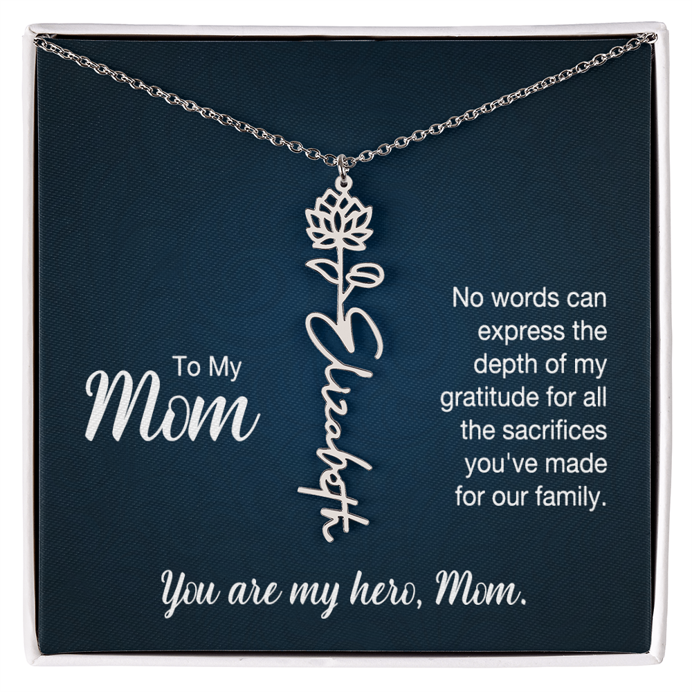 A silver floral filigree necklace with the name 'Elizabeth' engraved, presented on a dark blue gift card with sentimental text for 'Mom'.