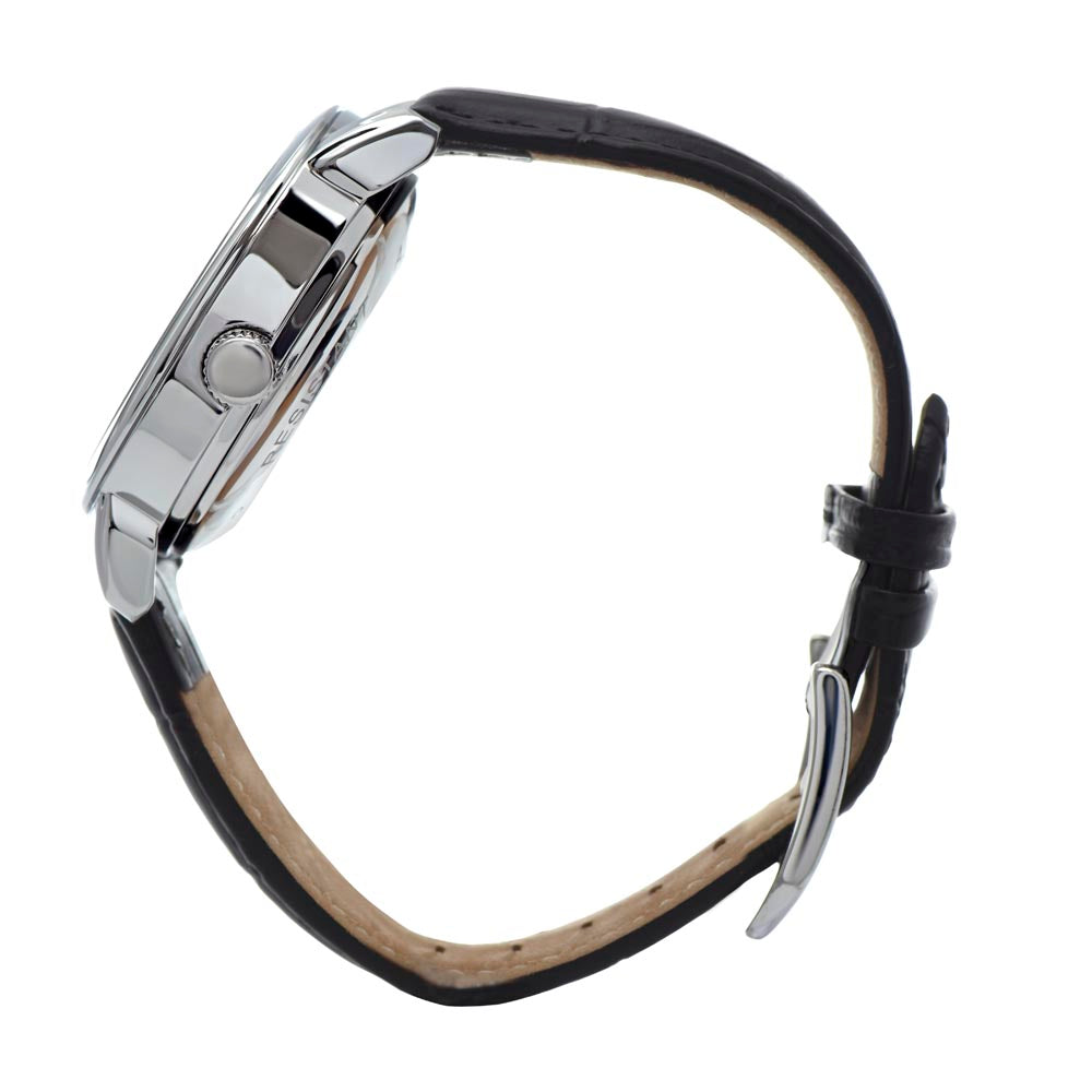 Side view profile photograph of a men's  skeleton watch, showcasing the thickness of the polished stainless steel case, the detail of the textured winding crown, and the secure attachment of the genuine leather strap.