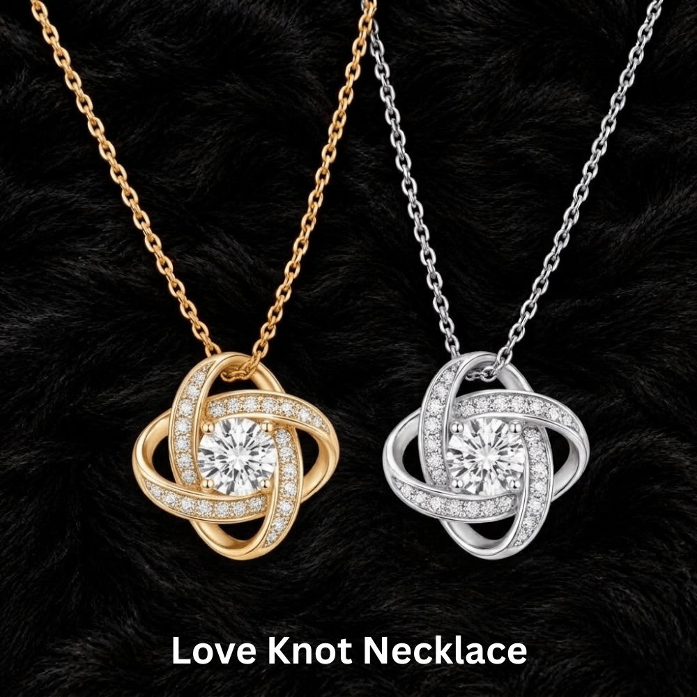 Two Love Knot necklace pendants displayed on black faux fur, one in yellow gold and one in silver, each featuring a central round clear gemstone surrounded by pavé-set smaller clear stones. Text at the bottom reads 'Love Knot Necklace'.